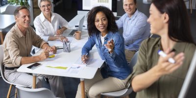 people-using-digital-device-while-meeting